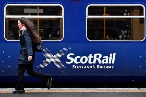 Getty Images Passenger at ScotRail train