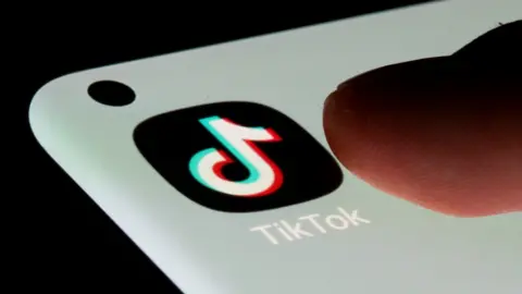 Reuters A TikTok app on a mobile phone