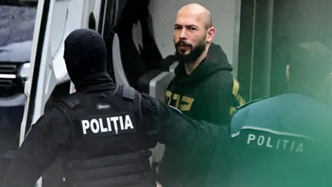 Getty Images Andrew and Tristan Tate were detained and appeared in court in Bucharest on Tuesday after arrest warrants were issued by the UK authorities