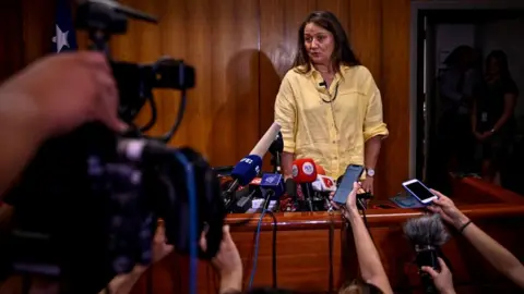 Getty Images Judge Paola Plaza Gonzalez speaks during a press conference after receiving the final report of the expert panel investigating the death of Chilean poet Pablo Neruda in Santiago on February 15, 2023.