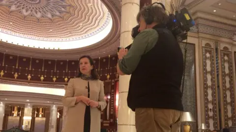 Lyse Doucet and Philip Goodwin record a piece to camera in the glitzy Ritz Carlton lobby in Riyadh.