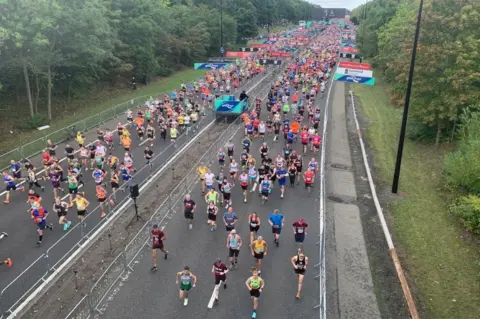 Aerial view of loads of runners starting the GNR