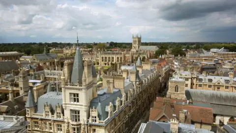 Getty Images Elevated view of the skyline and spires of Cambridge, Trinity College and the Chapel of St John's college