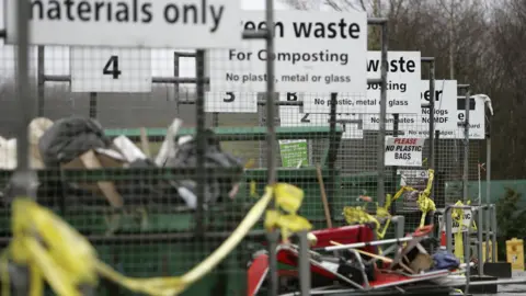Various recycling bays at a recycling centre