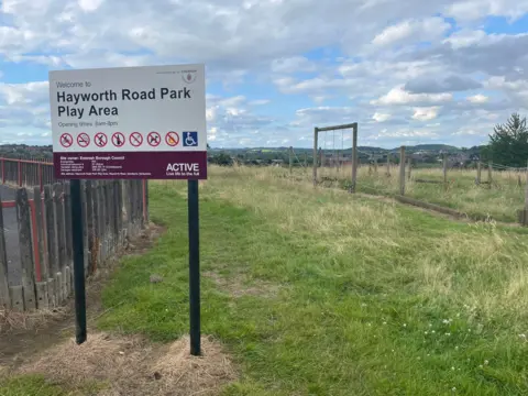 A sign at a play area