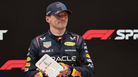Max Verstappen holds his sprint medal after winning in China 