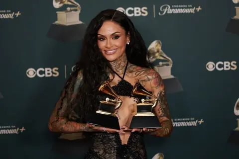 Getty Images Kehlani holds the Grammys for Best R&B Performance and Best R&B Song at the show