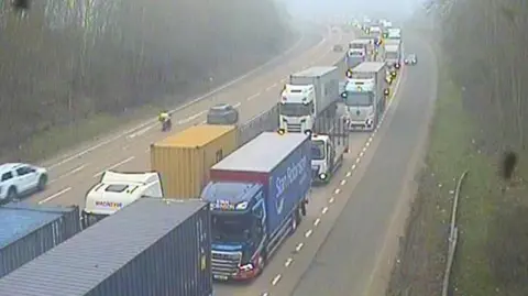 Traffic backed up on part of the A14. Vehicles can be seen nearly bumper to bumper on one of the carriageways.