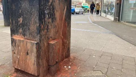 dried paan splats on an electricity box