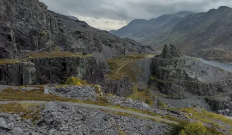 Getty Images Dramatic grey slate landscape of a sprawling old mine set within the mountains of Eryri