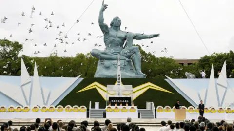 Reuters Nagasaki peace statue during ceremony in 2010