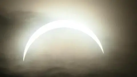 BBC WeatherWatchers/Wellies Full of Water the eclipse covered by clouds 