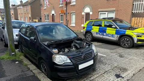 A burnt-out car