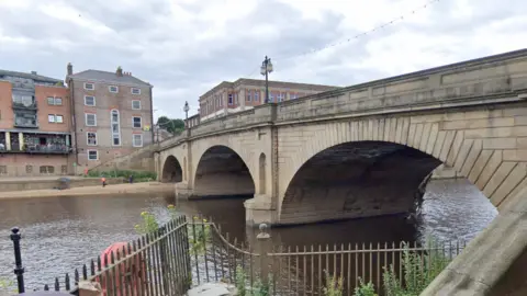 A view of Ouse Bridge in York from the riverside