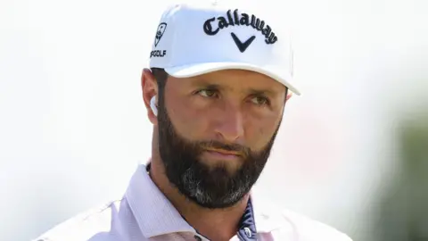 Spanish golfer Jon Rahm looks on