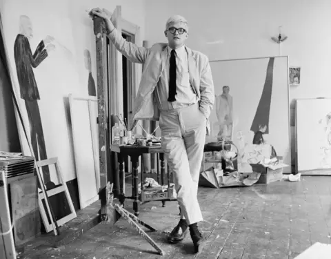 Getty Images English artist David Hockney in a studio with some of his work, circa 1967. 