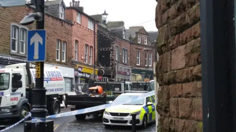 Paul Simcock-Young The outside of the building with police tape