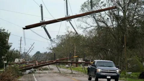 Reuters Downed power lines in Iowa, Louisiana