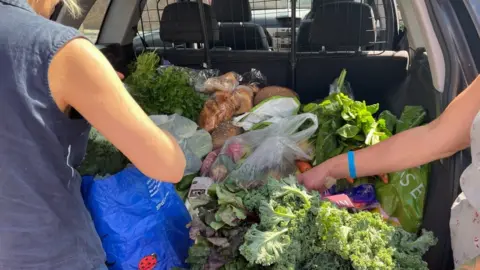 Sarah Frazer Fresh produce in the back of a car