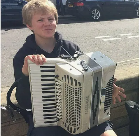 Macdonell family Harris playing his accordion