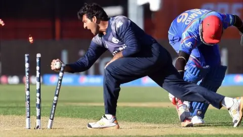 Getty Images Majid Haq in action for Scotland