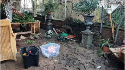 Mud on patio after flooding