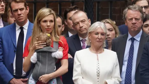 PA Media Alister Jack with others outside Downing Street