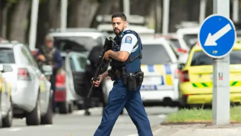 EPA Armed police patrol following a shooting resulting in multiply fatalities and injuries at the Masjid Al Noor on Deans Avenue in Christchurch, New Zealand, 15 March 2019.