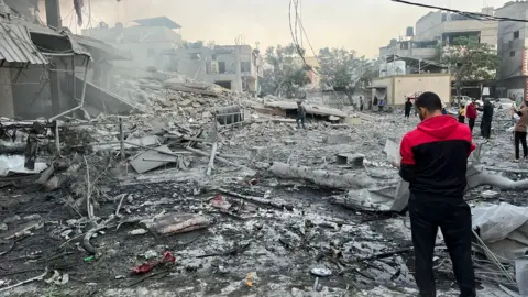Getty Images Buildings destroyed in Gaza after Israel resumes its attacks