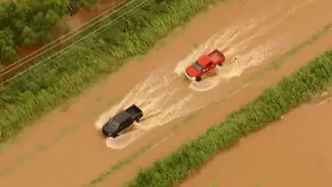 Cars driving in water