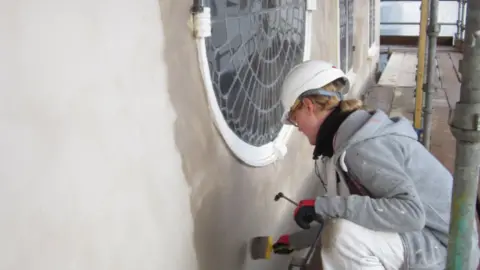 The Construction Team Sian McCarthy, painter for F A Valiant & Son Ltd, working at the Unitarian Meeting House