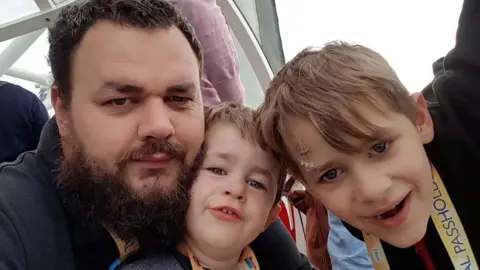 Katie Milne Steven Cooke with two of his sons