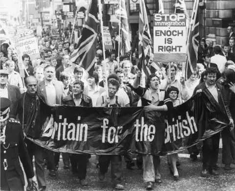 Getty Images Meat porters march on the UK Home Office in 1972, bearing a "Britain for the British" banner