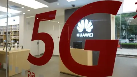 VCG / Getty Images Huawei's store in Beijing advertising 5G