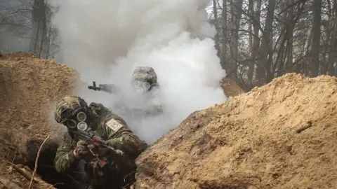 Ukrainian troops taking part in chemical weapon hazard drills