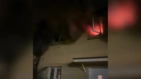 Oli Hopson-Ward Flames and smoke coming out of window of house