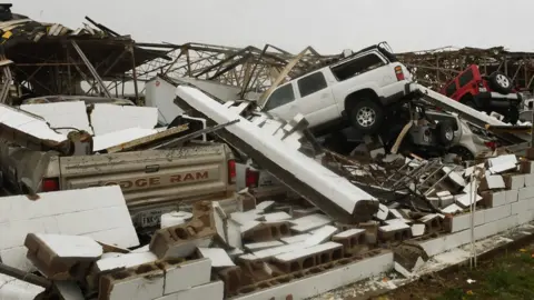 AFP Destroyed vehicles and buildings at Rockport Airport