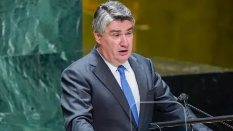 Getty Images Croatian President Zoran Milanovic speaking in front of a group of people at the UN