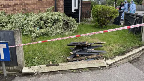 Samuel Montgomery/PA Damage to a property on Laing Close near the scene of the attack