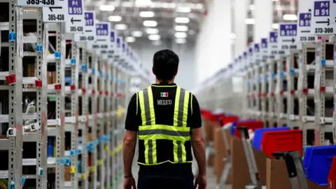 Reuters A worker in an Amazon warehouse in Mexico City, Mexico