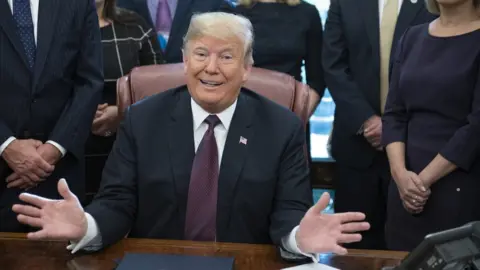 EPA US President Donald J. Trump gestures during the signing of the Cybersecurity and Infrastructure Security Agency Act in the Oval Office of the White House in Washington, DC, USA, 16 November 2018.