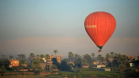 AFP A hot air balloon flying over Luxor, Egypt - Thursdsay 25 January 2019