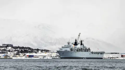 Crown copyright HMS Albion with the Norwegian Fjords in the background