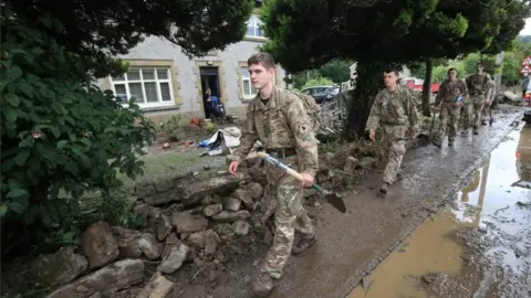 PA Media Soldiers help clear up
