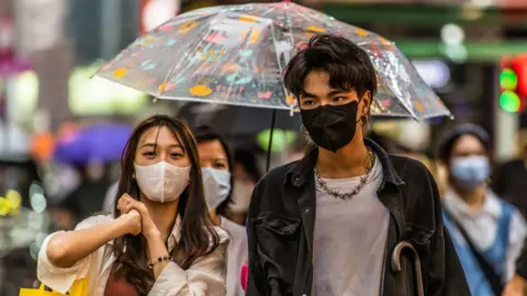 Getty Images People on street in Hong Kong.