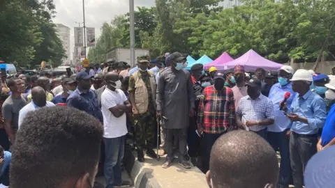 Work at the site was stopped when Lagos governor (centre) visited the site