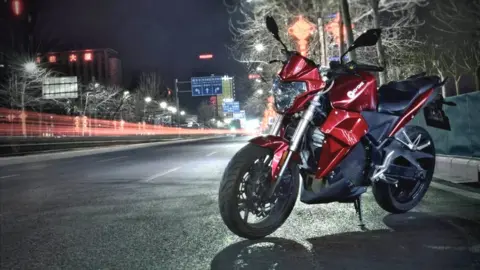 Evoke Motorcycles Evoke Urban S motorbike at night