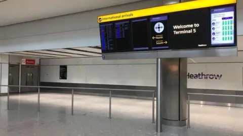 PA Media Empty Heathrow arrivals