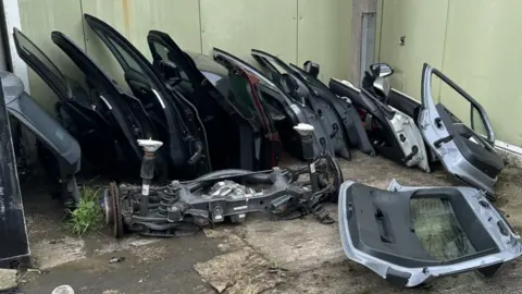 SYP Car doors lined up in a row