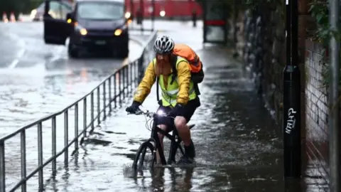 PA Media Man on bicycle in Sheffield